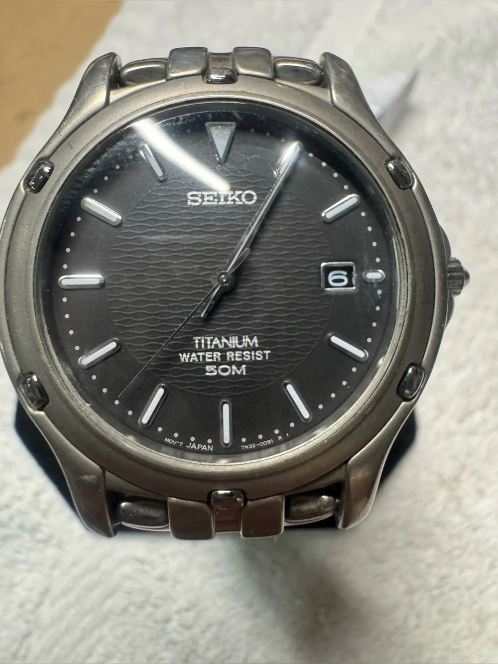 Seiko Titanium Watch with Black Dial and Silver Accents